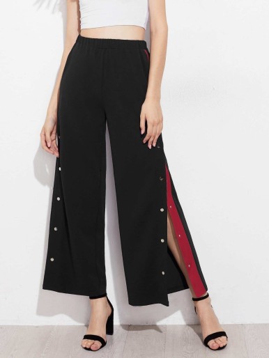 Pants with press studs on legs