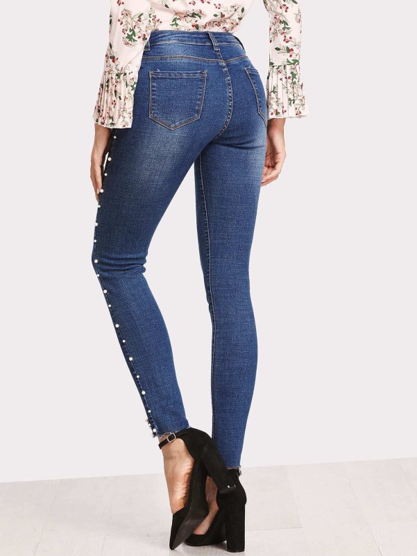 Skinny jeans with side pearls