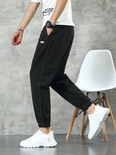 Men Letter Patched Drawstring Carrot Pants