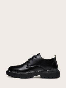 Men's black formal shoes with a wide base
