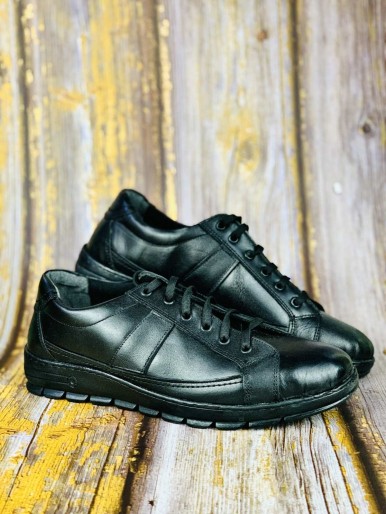 Glossy black men's sports shoes with black sole