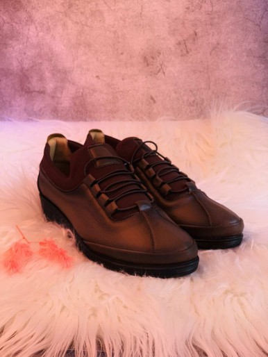 Comfortable brown women's shoes with a leather strap with a medical medium heel