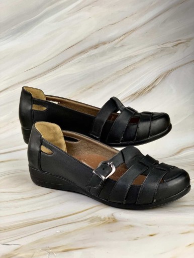 Comfortable black women's shoes with a buckle and medical leather straps