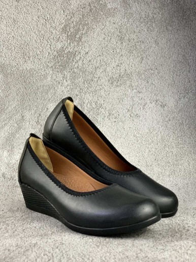 Comfortable black women's shoes with decorative eyelets and breathable feet, medical mid-heel