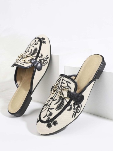 Mules with floral pattern brake with design
