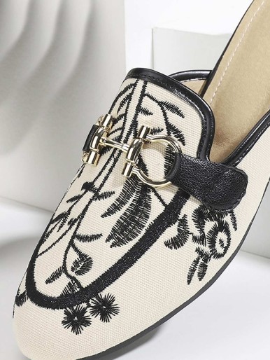 Mules with floral pattern brake with design