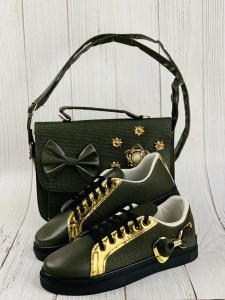 A bag, shoes and a purse, golden and olive, with a decorative knot in the form of a flower with fur