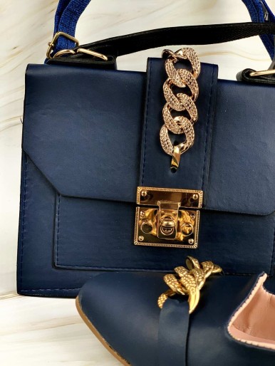 Navy bag and shoes with golden rings