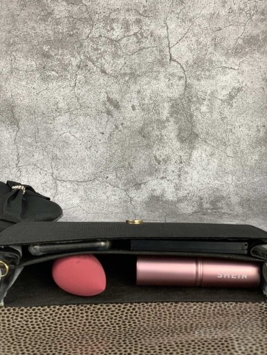 Bag and shoes in black fabric with a decorative metal flower