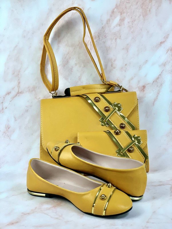 Yellow bag, shoes and wallet with a decorative metal ring