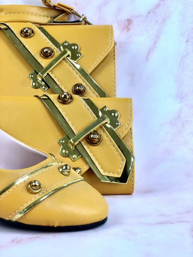 Yellow bag, shoes and wallet with a decorative metal ring