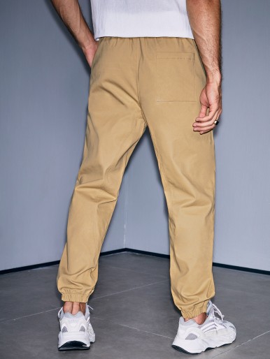 Men Drawstring Waist Slant Pocket Pants