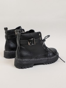 Lace-up boot with a metal eyelet