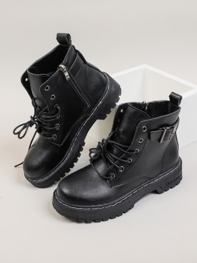 Lace-up boot with a metal eyelet