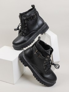 Lace-up boot with a metal eyelet