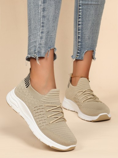 Beige women's sports shoes with laces