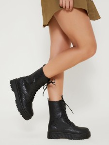 Black women's boots with a snakeskin print