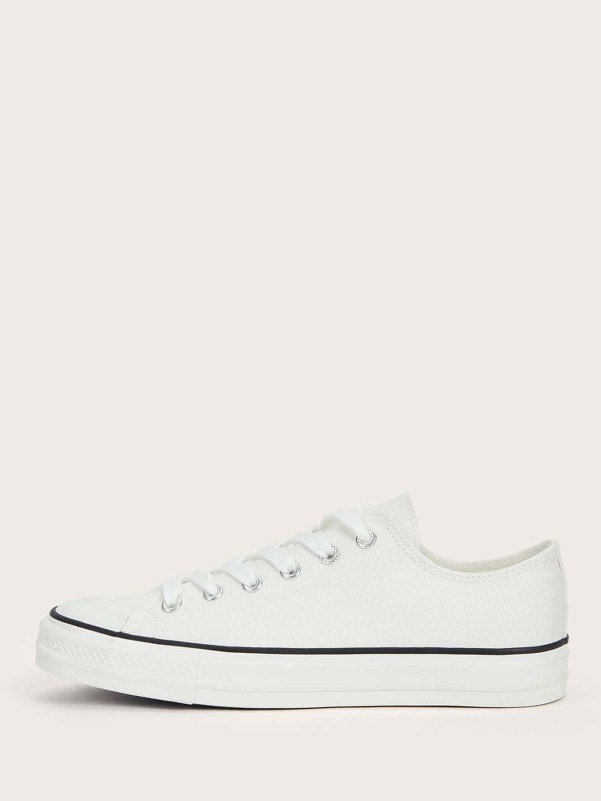 White sneakers with white sole and laces