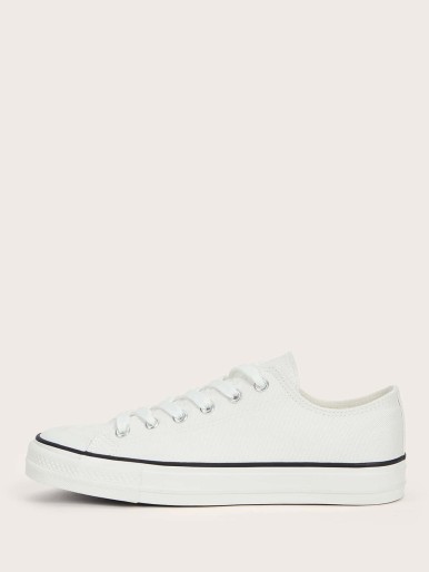 White sneakers with white sole and laces