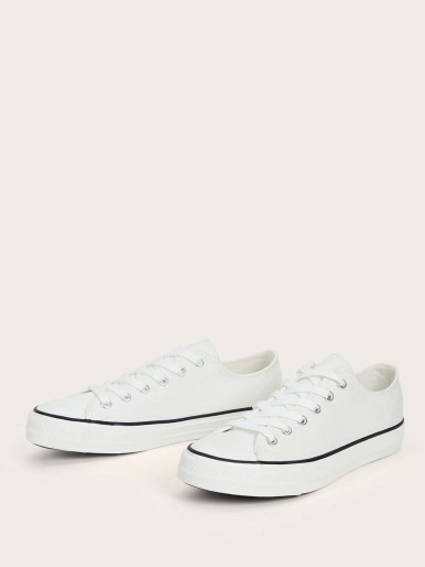White sneakers with white sole and laces