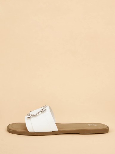 Beige women's slippers with a wide bow