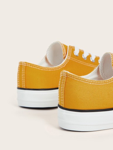 Cumin yellow sports shoes with white sole and laces