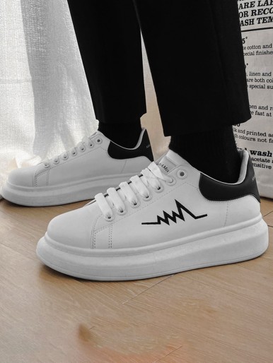 Black and white sports shoes with laces