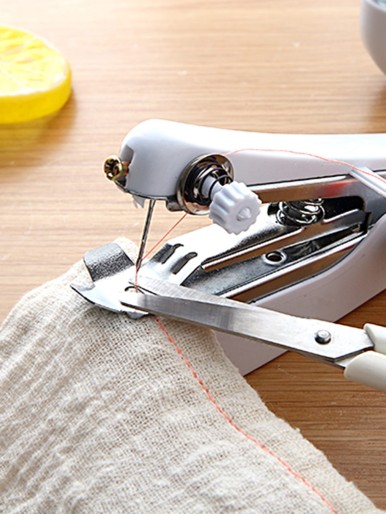 Hand-held Sewing Machine