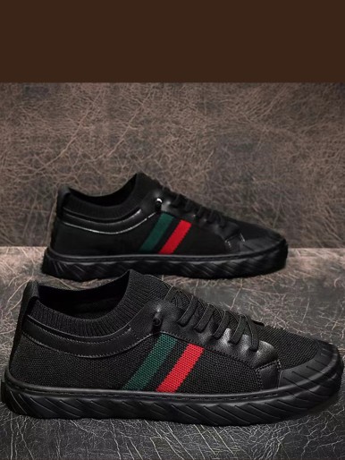 Black Radhi shoes with colorful stripes