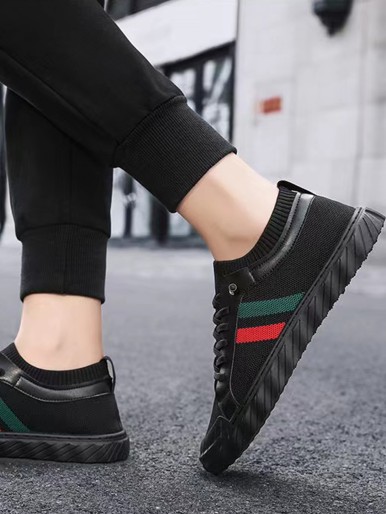 Black Radhi shoes with colorful stripes